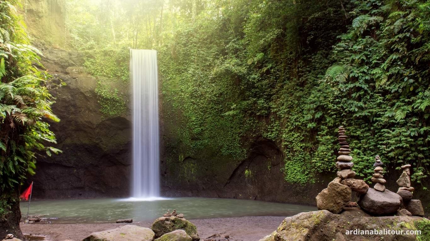 Tibumana Waterfall hidden gem in Ubud surrounded by jungle trees.jpg